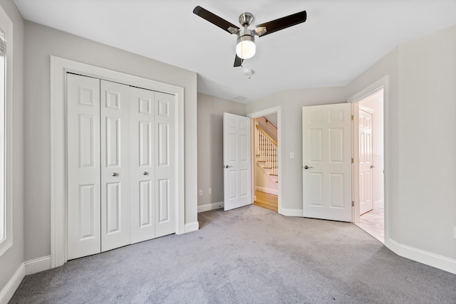 31 Cambridge Ct, Colchester, CT 06415 - unfurnished bedroom with carpet, a closet, baseboards, and a ceiling fan
