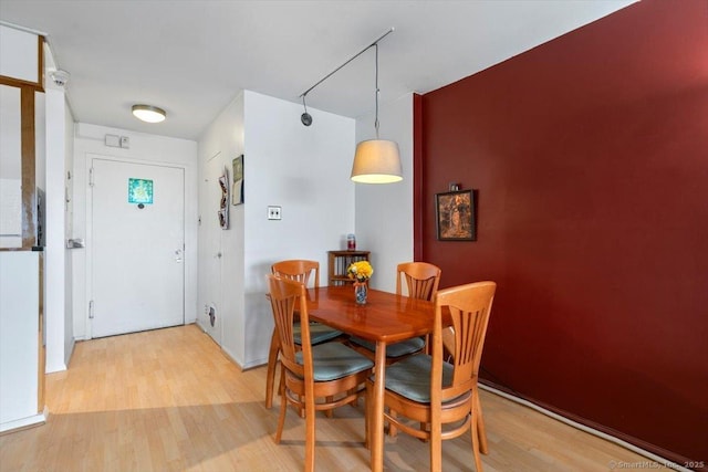 dining area with light wood finished floors