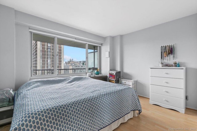 bedroom with light wood-style floors