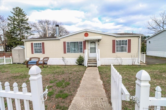 54 Western Sands Sands, Wallingford, CT 06492 - manufactured / mobile home with fence private yard, a front lawn, entry steps, an outbuilding, and a storage unit