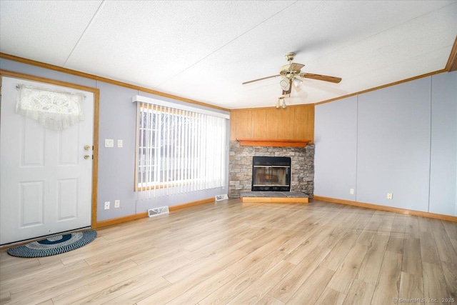 54 Western Sands Sands, Wallingford, CT 06492 - unfurnished living room with a fireplace, a ceiling fan, crown molding, visible vents, and wood finished floors
