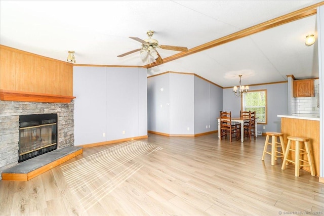 54 Western Sands Sands, Wallingford, CT 06492 - living area featuring crown molding, ceiling fan with notable chandelier, a fireplace, light wood-type flooring, and baseboards