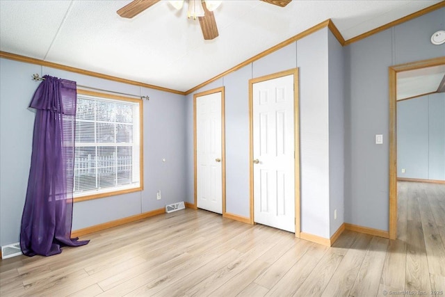 54 Western Sands Sands, Wallingford, CT 06492 - unfurnished bedroom with crown molding, visible vents, wood finished floors, and lofted ceiling