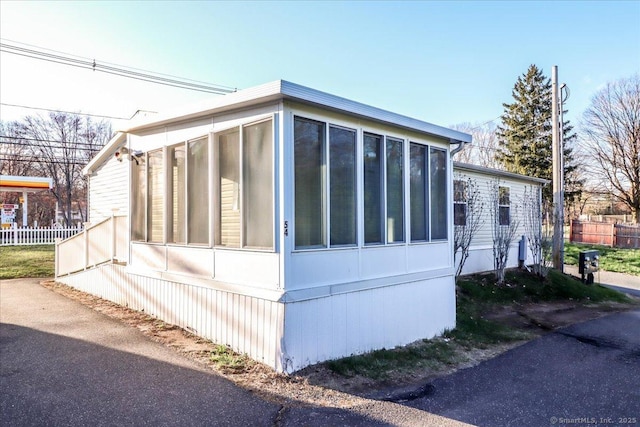 54 Western Sands Sands, Wallingford, CT 06492 - view of side of property featuring a sunroom and fence