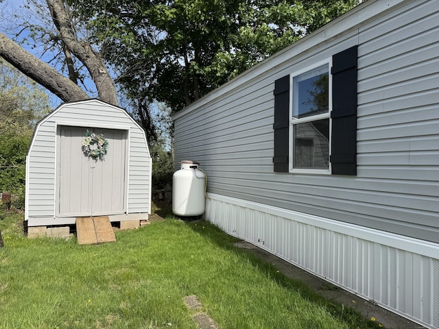 62 Fort Hill Rd Lot 10, Groton, CT 06340 - view of home's exterior featuring a storage unit, an outbuilding, and a lawn