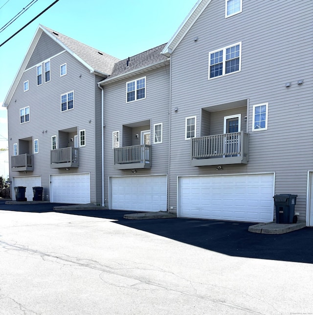 1 Union Ave Unit 4, Danbury, CT 06810 - rear view of house with cooling unit, a garage, and driveway