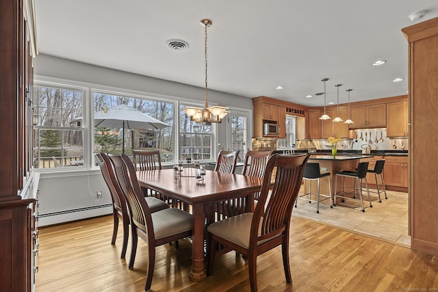 181 Picketts Ridge Rd, Redding, CT 06896 - dining area featuring a baseboard heating unit, a chandelier, light wood-style floors, and recessed lighting