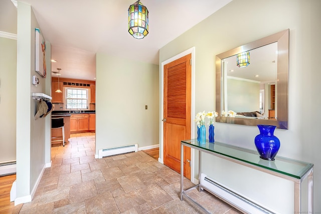 181 Picketts Ridge Rd, Redding, CT 06896 - hallway with baseboard heating, baseboards, a baseboard radiator, stone tile floors, and ornamental molding
