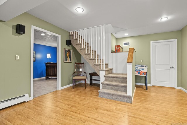 181 Picketts Ridge Rd, Redding, CT 06896 - stairs featuring wood finished floors, a baseboard radiator, recessed lighting, and baseboards