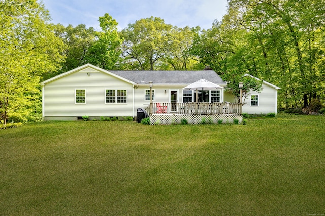 181 Picketts Ridge Rd, Redding, CT 06896 - back of property featuring a deck, a lawn, a shingled roof, and a chimney