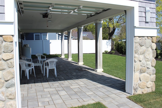 view of patio featuring fence