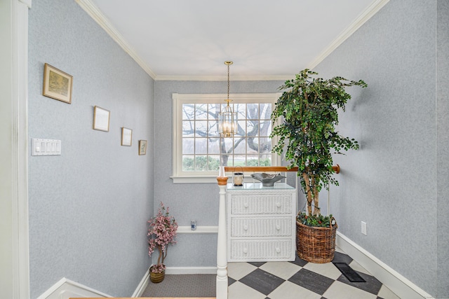 interior space with baseboards, ornamental molding, tile patterned floors, and a chandelier