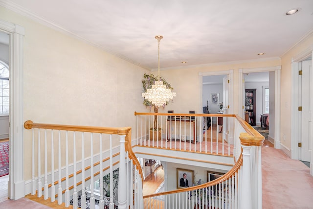 staircase featuring crown molding, baseboards, recessed lighting, and a notable chandelier