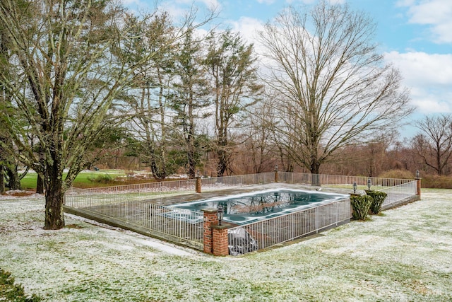 view of pool with a fenced in pool and fence