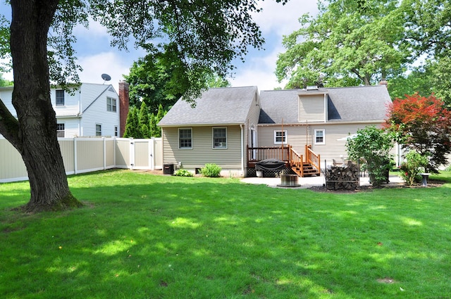 5 Middle Dr, Windsor Locks, CT 06096 - back of property featuring a deck, a gate, a shingled roof, and a chimney