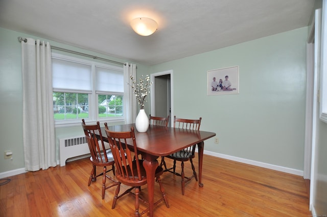 5 Middle Dr, Windsor Locks, CT 06096 - dining room with radiator heating unit and light wood-style floors