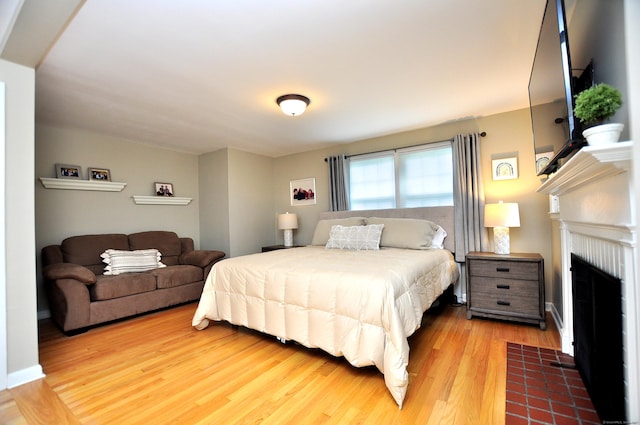 5 Middle Dr, Windsor Locks, CT 06096 - bedroom featuring light wood finished floors and a tile fireplace
