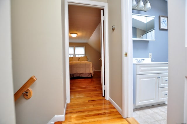 5 Middle Dr, Windsor Locks, CT 06096 - corridor featuring light wood-type flooring, lofted ceiling, and a chandelier