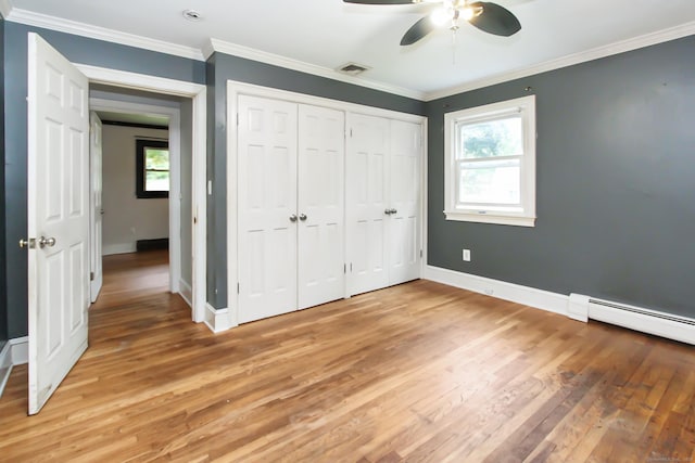 15 Old Stream Ln, Trumbull, CT 06611 - unfurnished bedroom featuring multiple windows, light wood finished floors, a baseboard heating unit, crown molding, and a ceiling fan