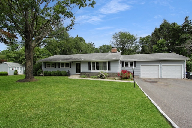 15 Old Stream Ln, Trumbull, CT 06611 - ranch-style house featuring asphalt driveway, an attached garage, a front yard, and a chimney