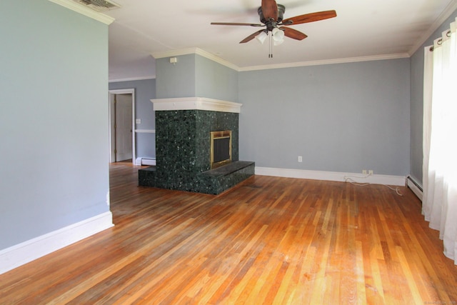 15 Old Stream Ln, Trumbull, CT 06611 - unfurnished living room with baseboard heating, wood-type flooring, a ceiling fan, a baseboard radiator, and a fireplace