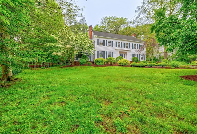 64 Blake Rd, Hamden, CT 06517 - colonial inspired home with a chimney and a front lawn