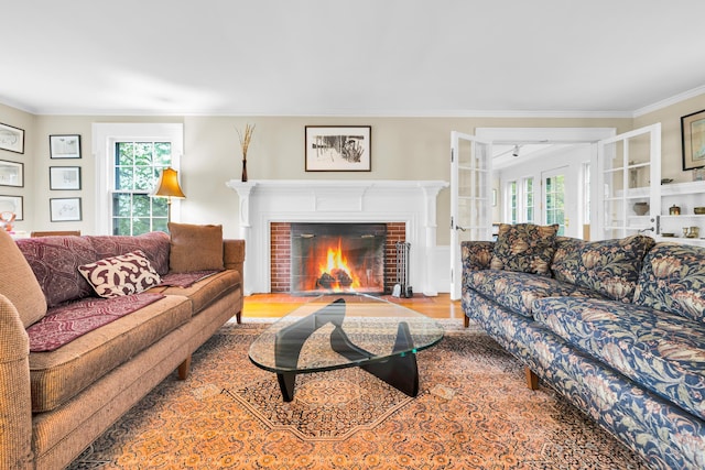 64 Blake Rd, Hamden, CT 06517 - living room featuring healthy amount of natural light, crown molding, wood finished floors, and a fireplace