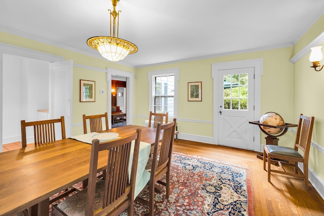 64 Blake Rd, Hamden, CT 06517 - dining room featuring light wood-style floors and crown molding