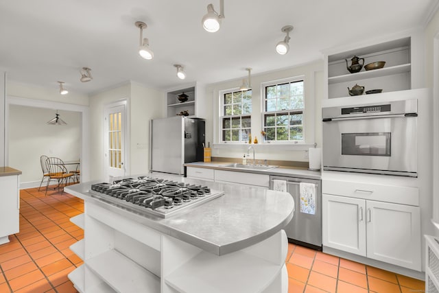64 Blake Rd, Hamden, CT 06517 - kitchen with open shelves, appliances with stainless steel finishes, light tile patterned floors, white cabinetry, and crown molding