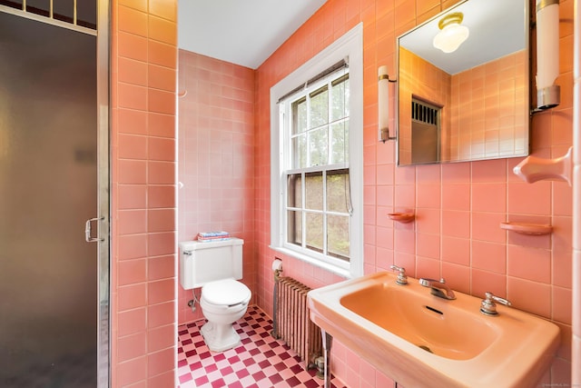 64 Blake Rd, Hamden, CT 06517 - full bathroom featuring tile walls, plenty of natural light, a shower stall, and radiator
