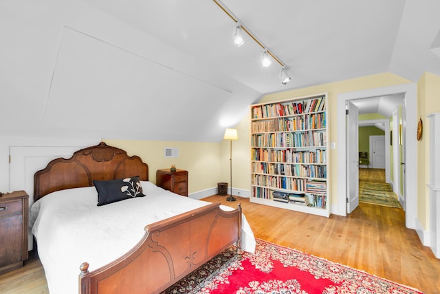 64 Blake Rd, Hamden, CT 06517 - bedroom featuring vaulted ceiling, light wood-type flooring, and track lighting