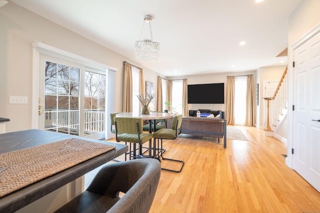 bedroom with an inviting chandelier, access to exterior, light wood finished floors, and recessed lighting