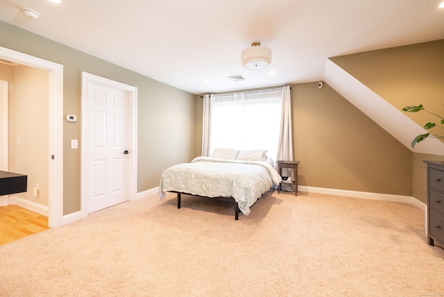 bedroom with light carpet, baseboards, visible vents, recessed lighting, and lofted ceiling
