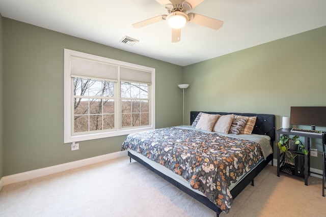 bedroom featuring baseboards, a ceiling fan, carpet flooring, and visible vents