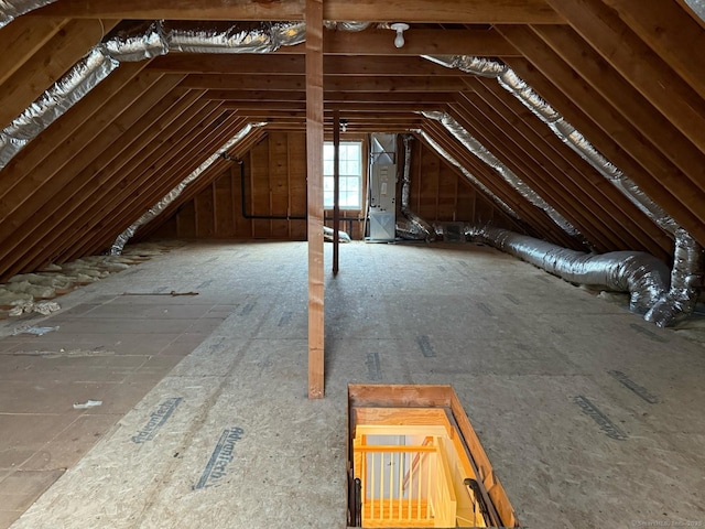 attic featuring heating unit
