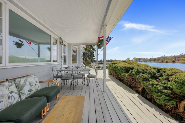 27 Wilbur Rd, Stonington, CT 06378 - wooden deck featuring outdoor dining space and a water view