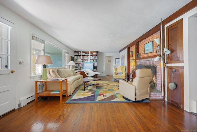 27 Wilbur Rd, Stonington, CT 06378 - living area with wood-type flooring, a brick fireplace, and baseboard heating