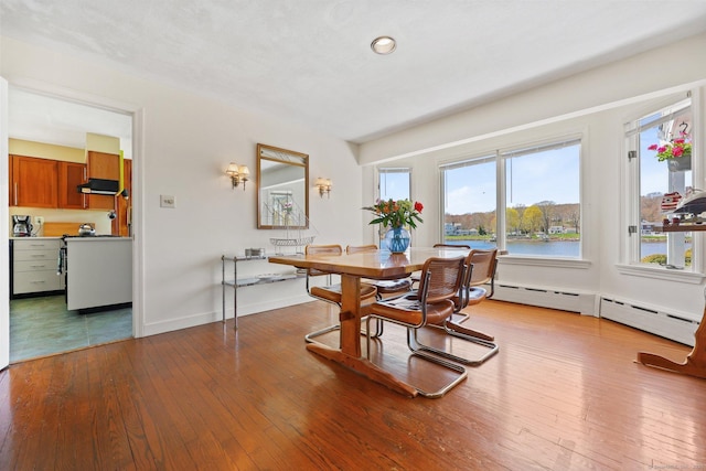27 Wilbur Rd, Stonington, CT 06378 - dining room with wood-type flooring, a baseboard radiator, baseboards, and recessed lighting