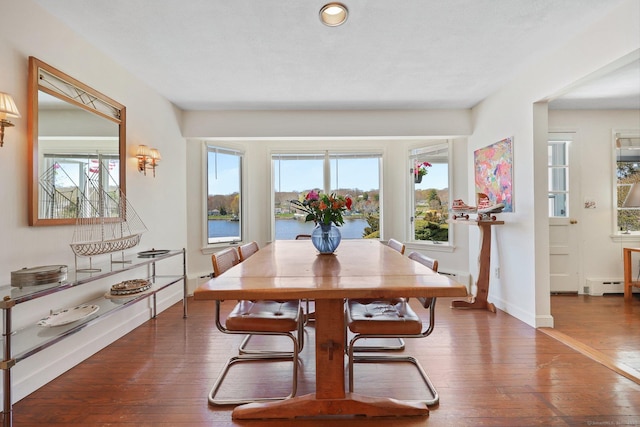 27 Wilbur Rd, Stonington, CT 06378 - dining space featuring wood-type flooring, baseboard heating, baseboards, and recessed lighting