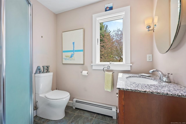 27 Wilbur Rd, Stonington, CT 06378 - bathroom featuring a baseboard heating unit, toilet, vanity, tile patterned flooring, and baseboards