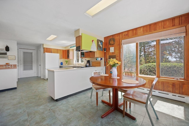 27 Wilbur Rd, Stonington, CT 06378 - dining area featuring wooden walls, healthy amount of natural light, and a baseboard heating unit