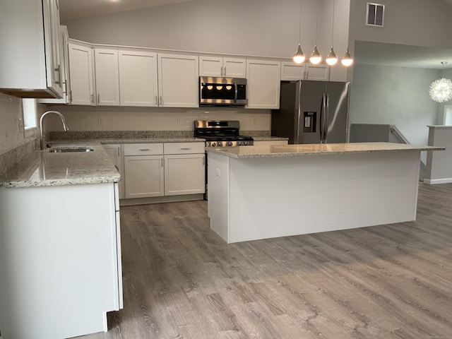 155 Peabody St, West Haven, CT 06516 - kitchen featuring white cabinetry, visible vents, a center island, appliances with stainless steel finishes, and a sink