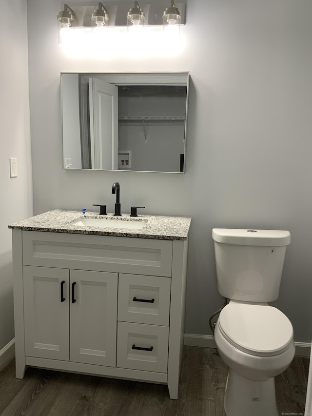 155 Peabody St, West Haven, CT 06516 - bathroom with vanity, baseboards, toilet, and wood finished floors
