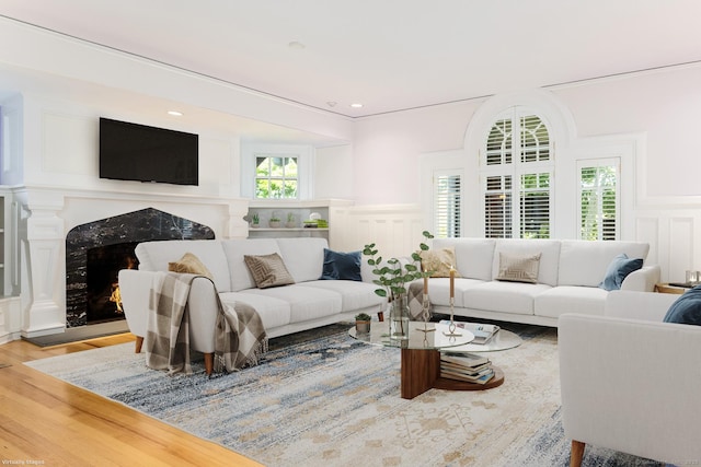 Rogers Is, Branford, CT 06405 - living room with a decorative wall, a wainscoted wall, wood finished floors, and a premium fireplace