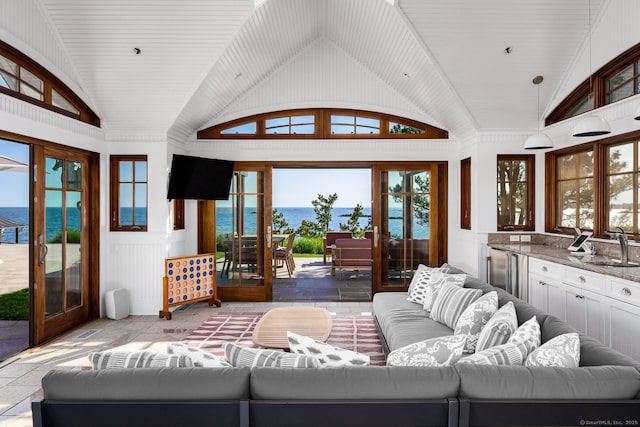 Rogers Is, Branford, CT 06405 - living area featuring french doors, lofted ceiling, and healthy amount of natural light