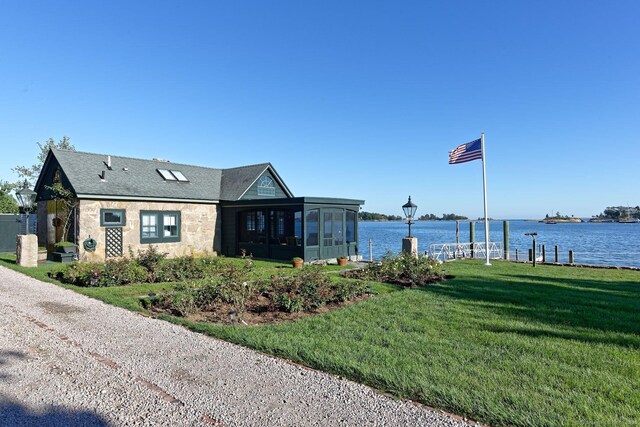 Rogers Is, Branford, CT 06405 - view of side of home with a sunroom, a yard, a water view, and stone siding