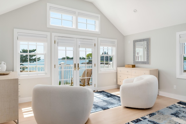 Rogers Is, Branford, CT 06405 - sitting room featuring high vaulted ceiling, french doors, and light wood-type flooring