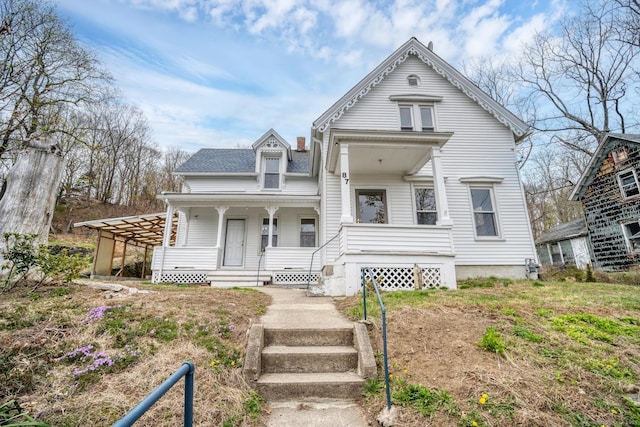 victorian house featuring covered porch