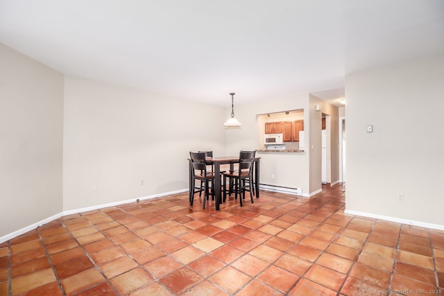 dining area featuring a baseboard radiator and baseboards