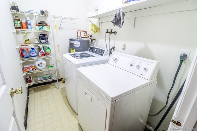 laundry area featuring independent washer and dryer, laundry area, and electric water heater